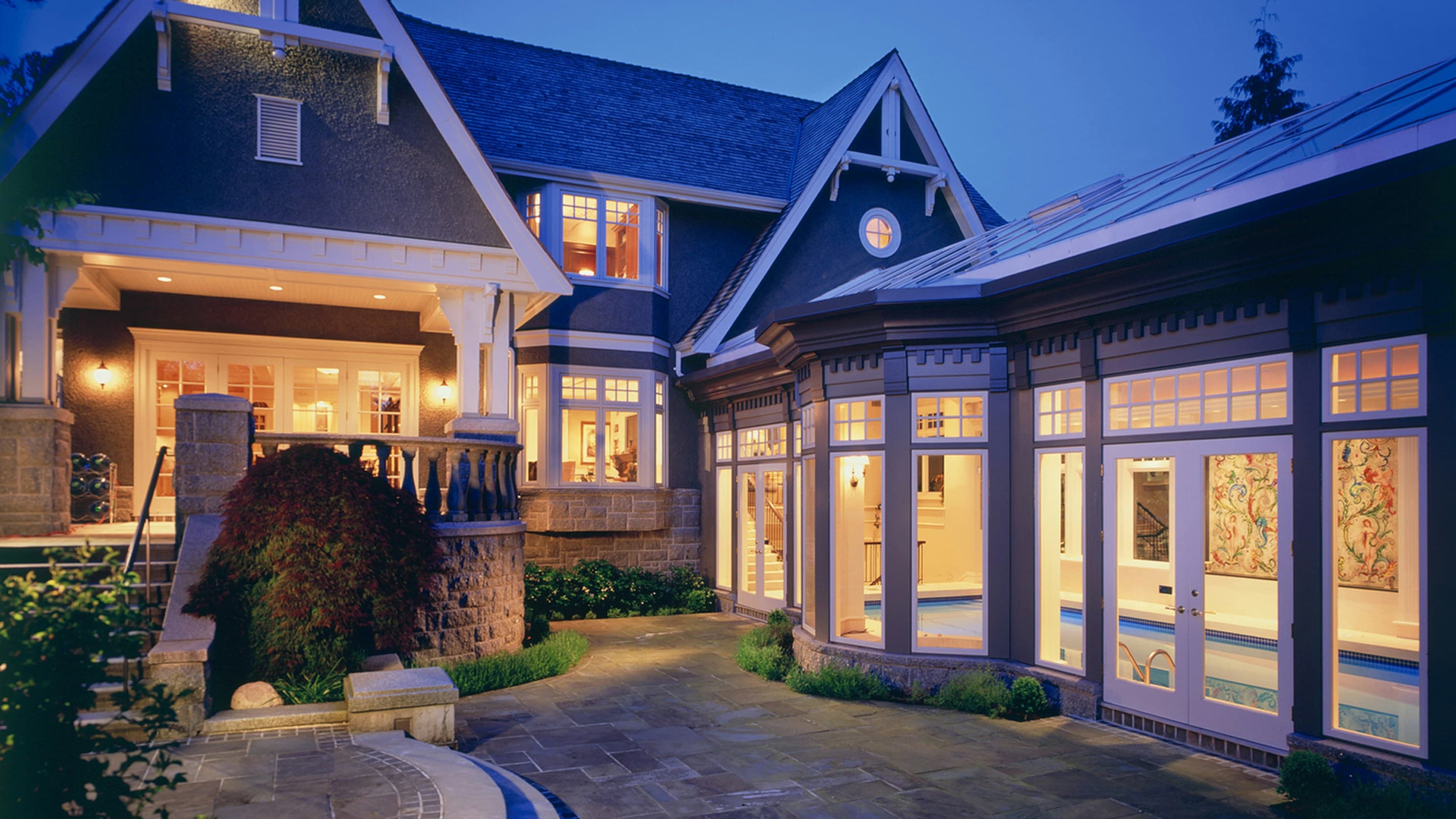 Premium smart home exterior illuminated at night